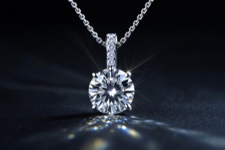 A pendant on a fine chain.