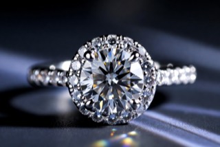 A solitaire ring with a round stone.