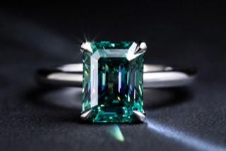 A ring photographed against a dark ground.