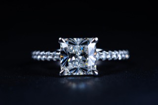 A ring photographed against a dark ground.