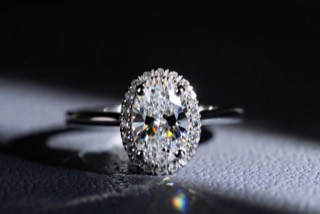A ring photographed against a dark ground.