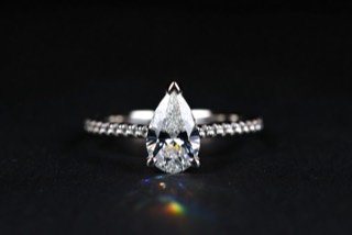 A ring photographed against a dark ground.
