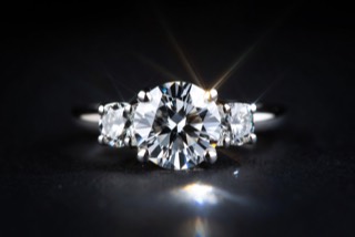 A ring photographed against a dark ground.