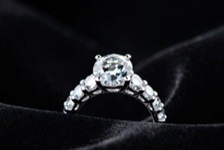 A ring photographed against a dark ground.