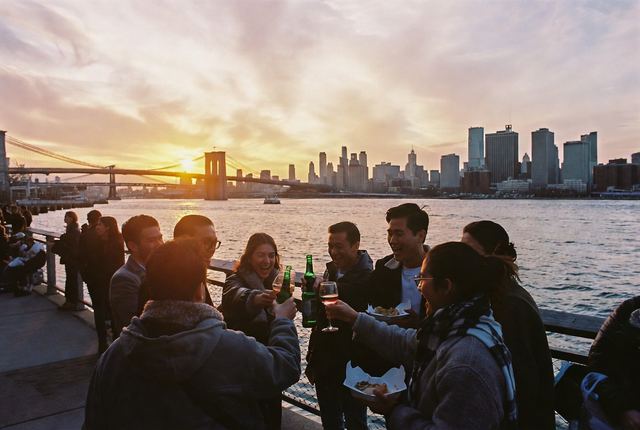 5:35 PM • Brooklyn Bridge Park — Pier Sunset Toast: Friends gather with drinks on the pier as the sun sets behind the Manhattan skyline. Perfect end-of-day ritual.